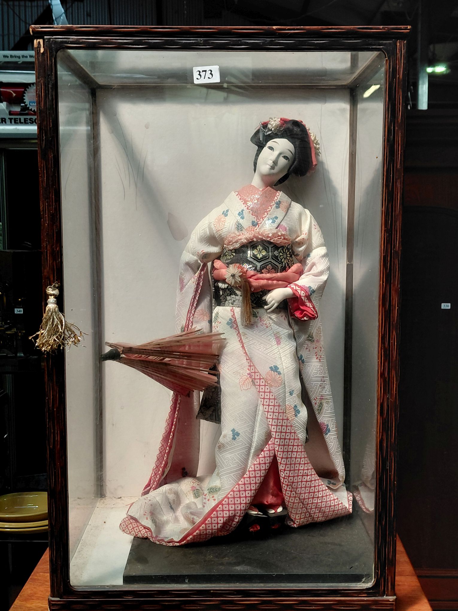 373 · GEISHA DOLL IN ANTIQUE WOODEN CASE