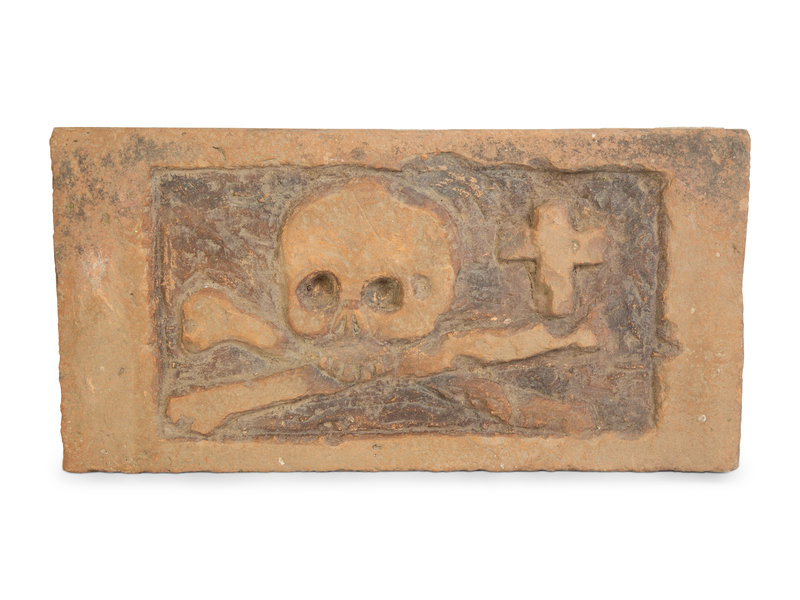 An Italian Terracotta Memento Mori Tomb Plaque
Height 8 x width 15 1/2 inches.