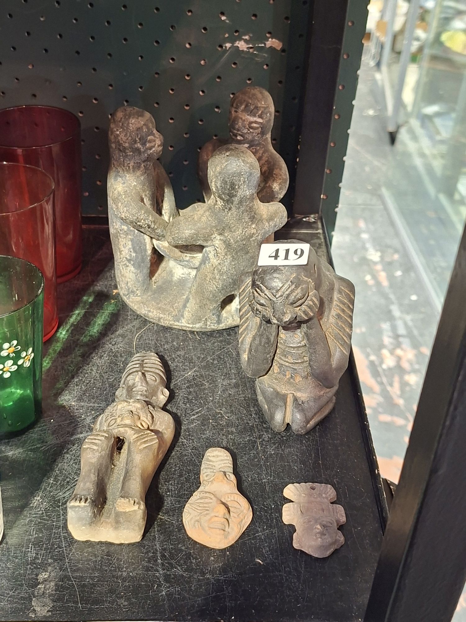 419 · TRIBAL STATUES AND WHISTLE