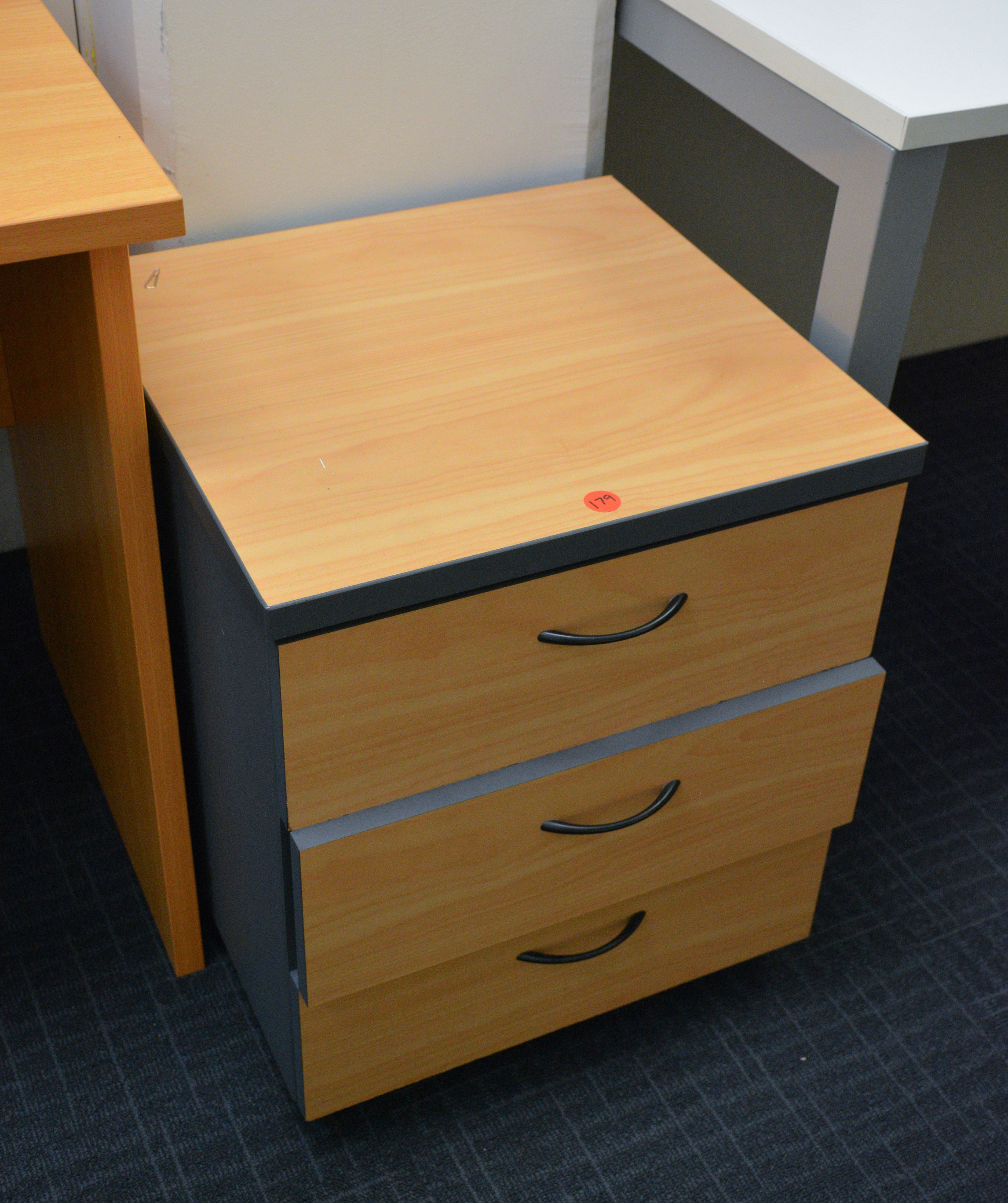 Wood Three Drawer Office Unit — sold at auction in New Zealand for $20