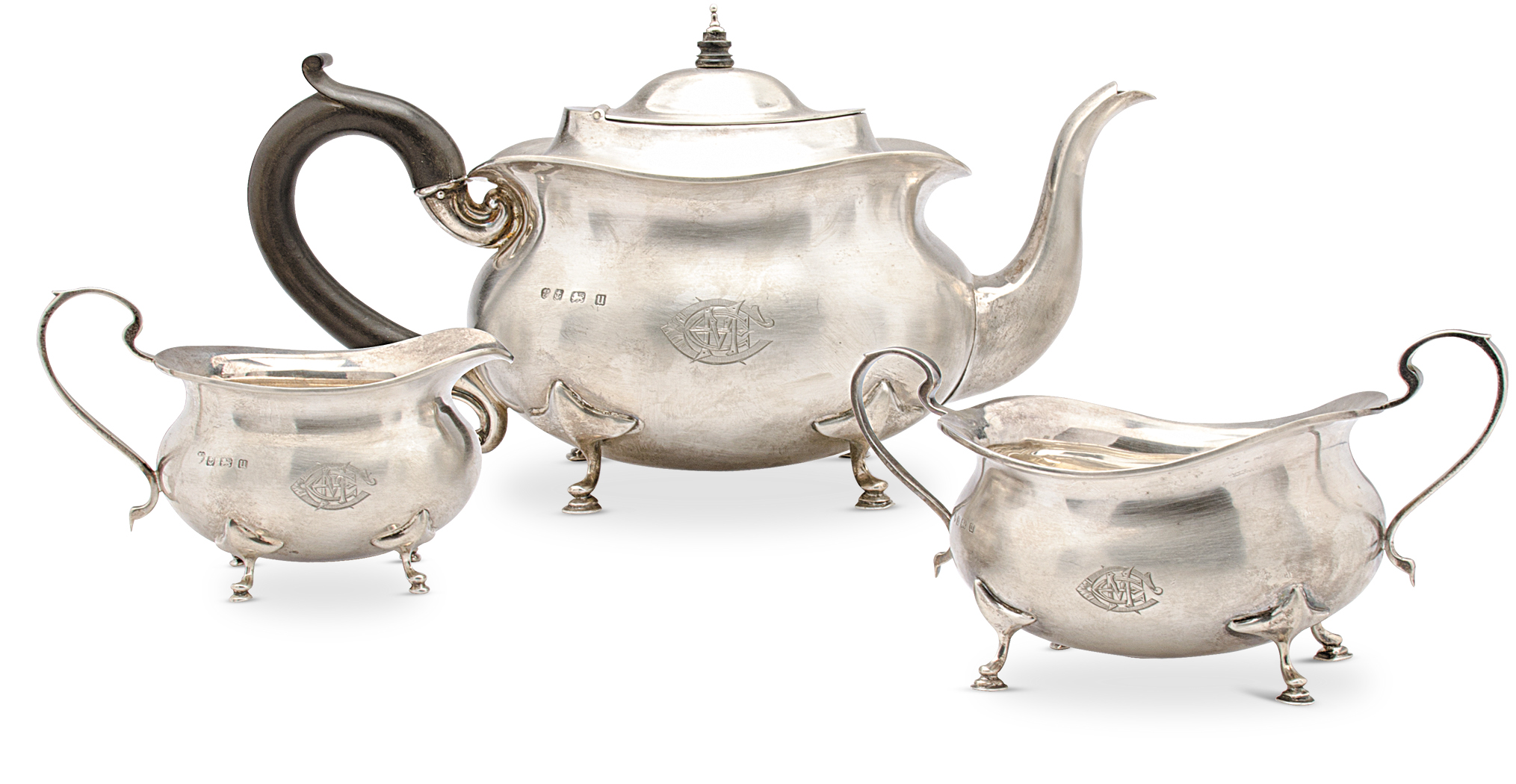 A silver three piece tea set