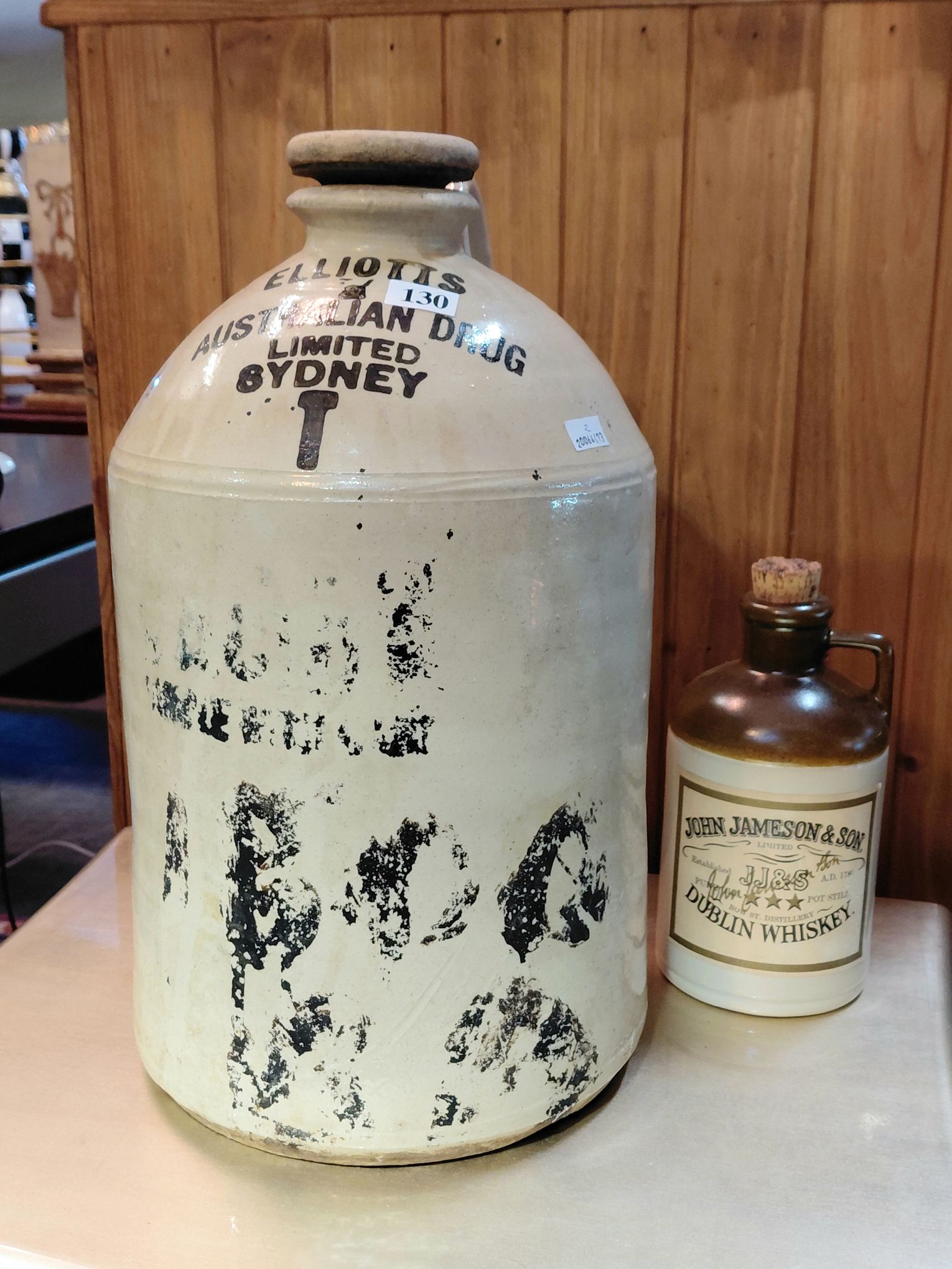 130 · STONEWARE DEMIJOHN