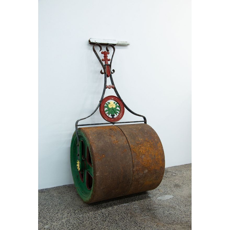 A late-19th-century cast iron garden roller