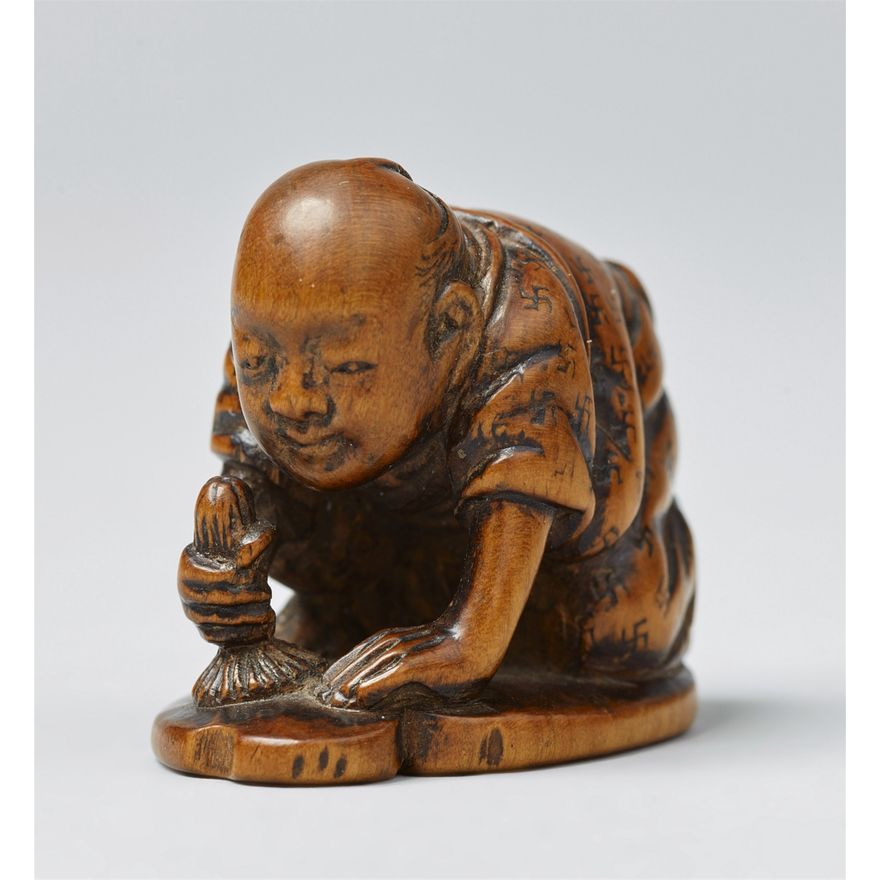 A boxwood netsuke of a man. 19th century