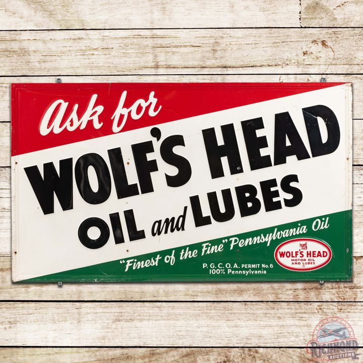 1957 Wolf's Head Oil and Lubes Embossed SST Sign