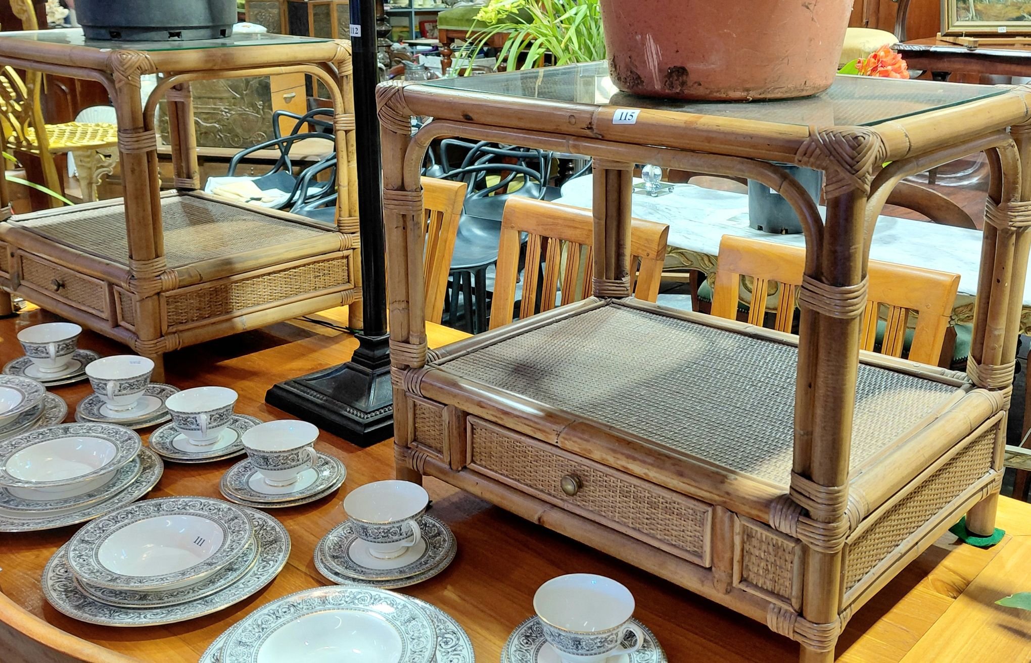 115 · A PAIR OF RATTAN SIDE TABLES