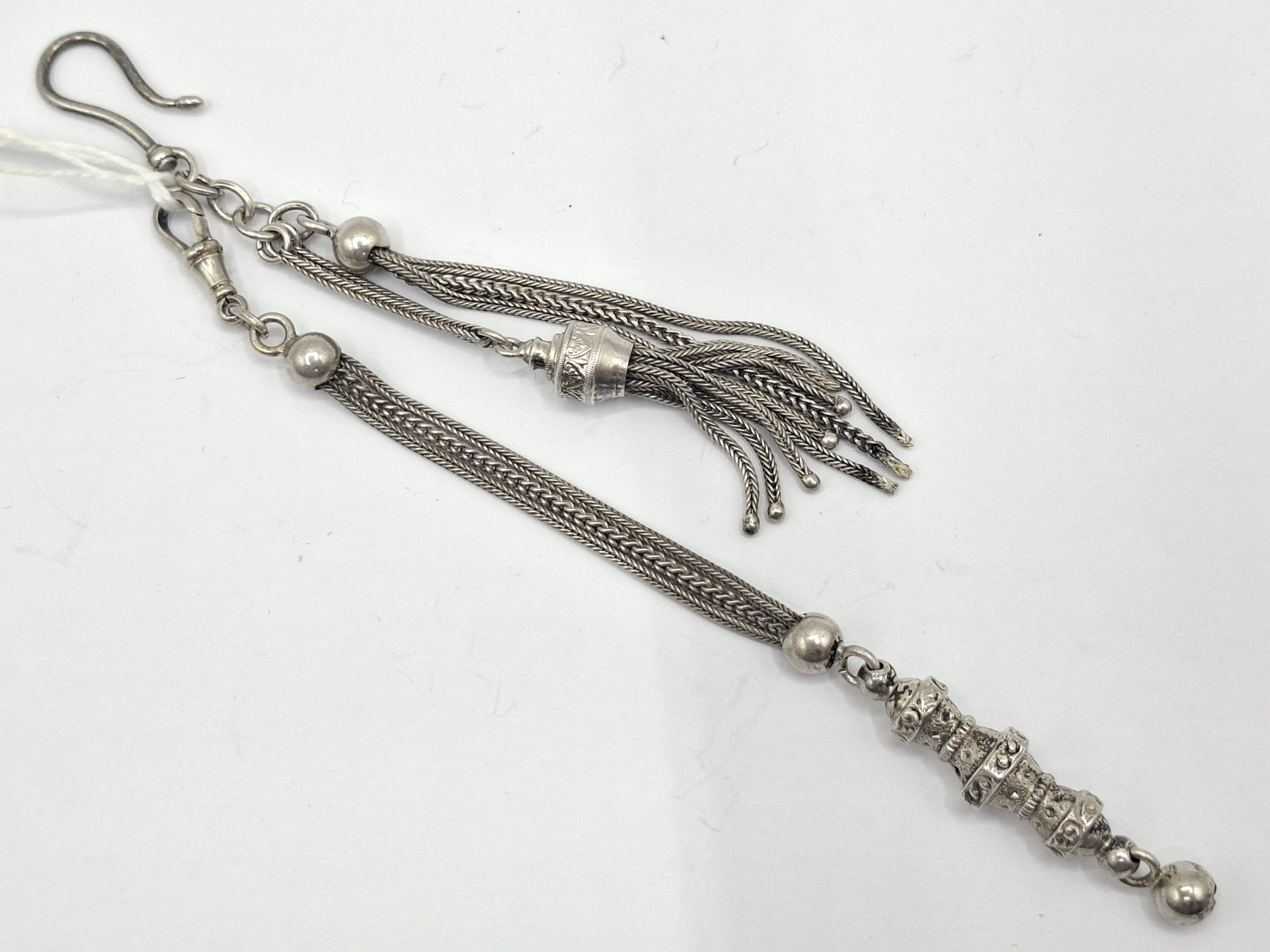 TWO ANTIQUE SILVER TASSELS