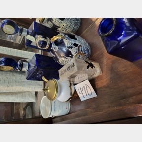 Whiskey flasks, advertising paint can radio and other items