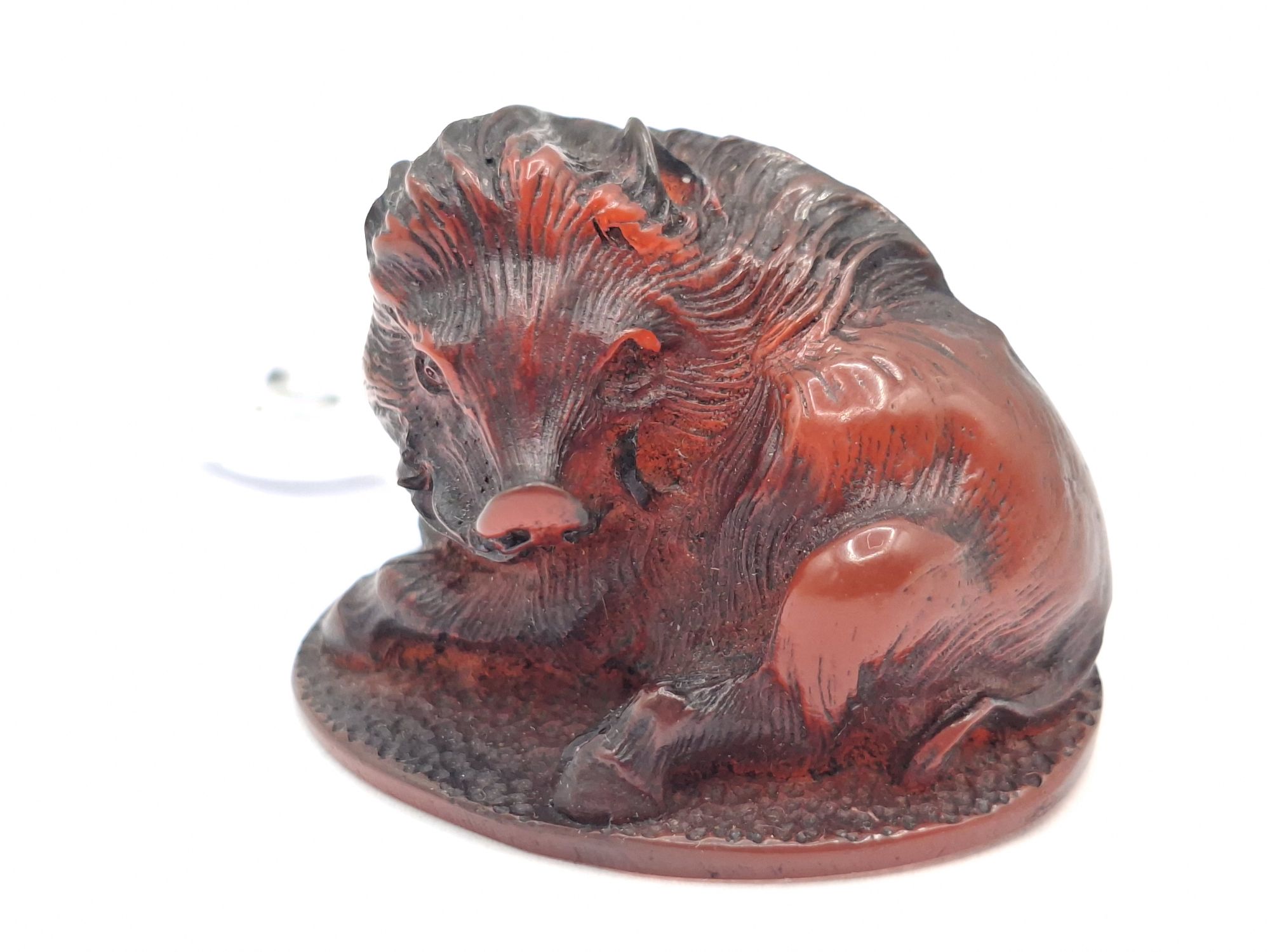 97 · JAPANESE CARVED AMBER NETSUKE