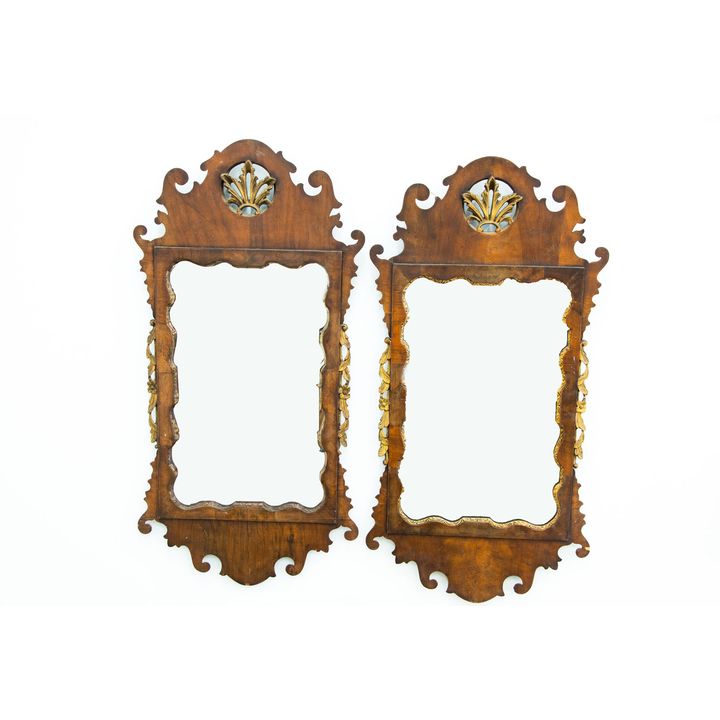 A pair of 18th-century walnut and gilt mirrors