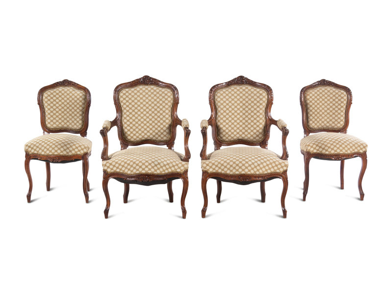 A Set of Four Louis XV Style Carved Walnut Chairs