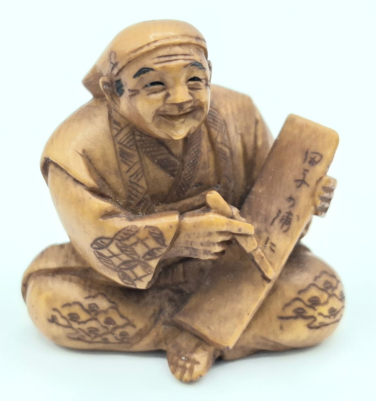 22 · JAPANESE CARVED IVORY NETSUKE
