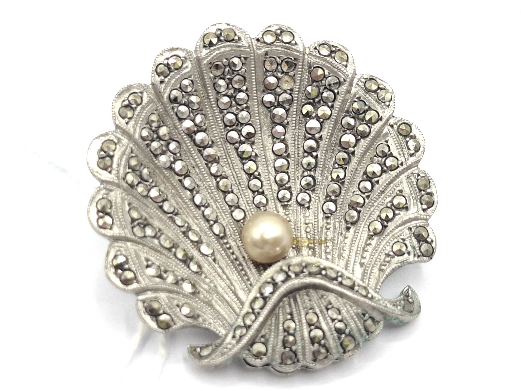 1053 · STERLING SILVER MARCASITE SHELL BROOCH