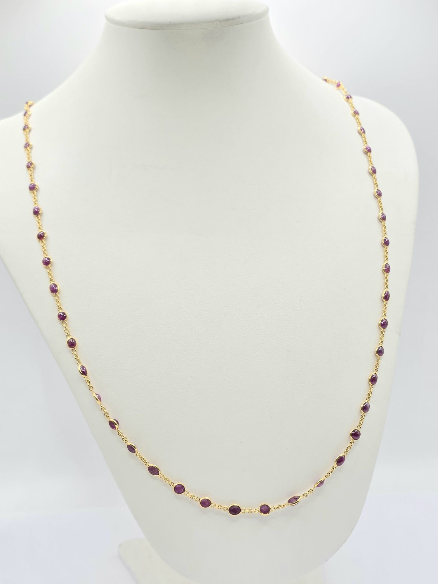 254 · 18CT SECTIONAL RUBY NECKLACE