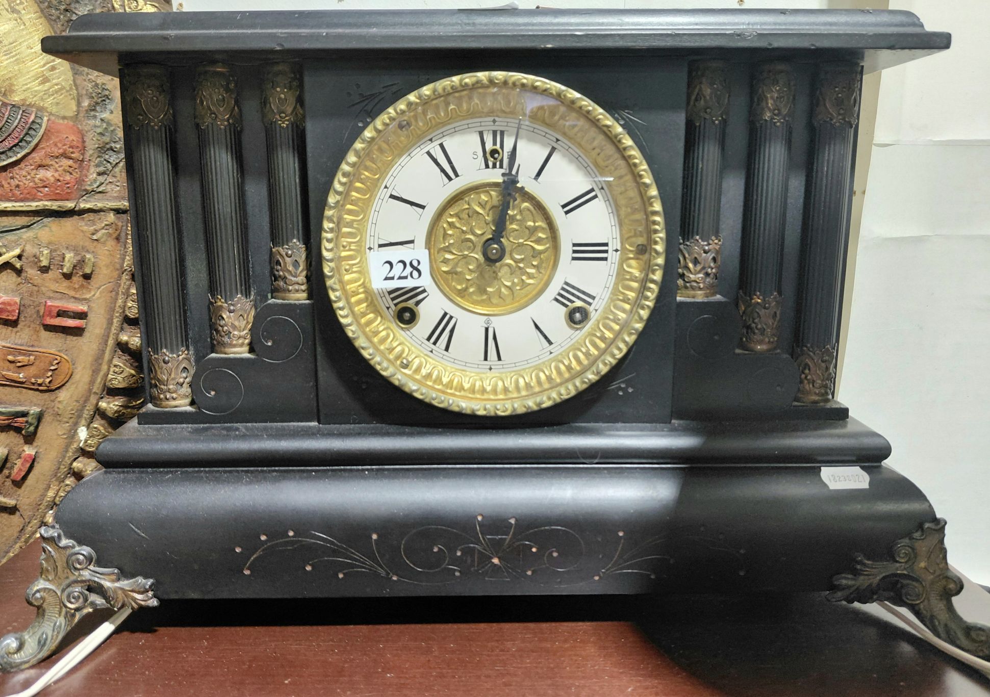 228 · EBONISED WOODEN MANTLE CLOCK