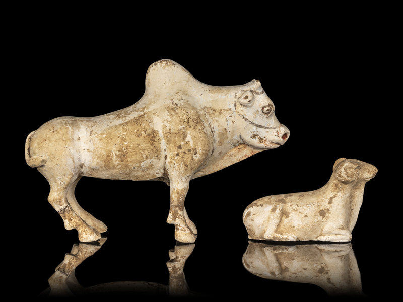 A Chinese Painted Pottery Figures of an Ox and a Ram