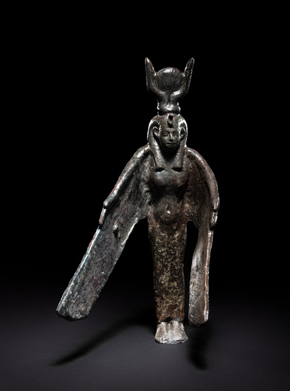 An Egyptian Bronze Winged Isis
Height 5 1/2 inches (14 cm).