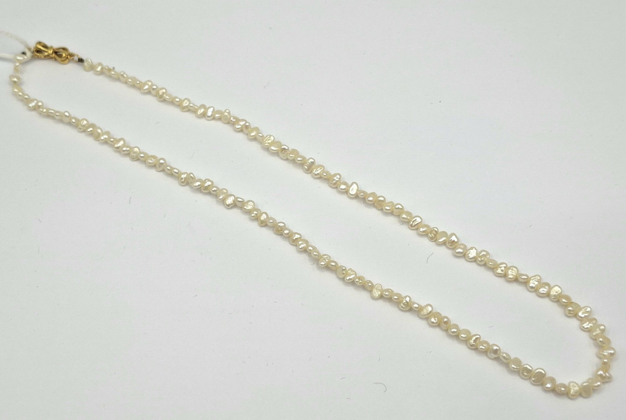 1115 · NATURAL SEED PEARL NECKLACE