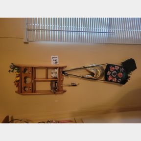 Wood shelf of decorative items and small purses