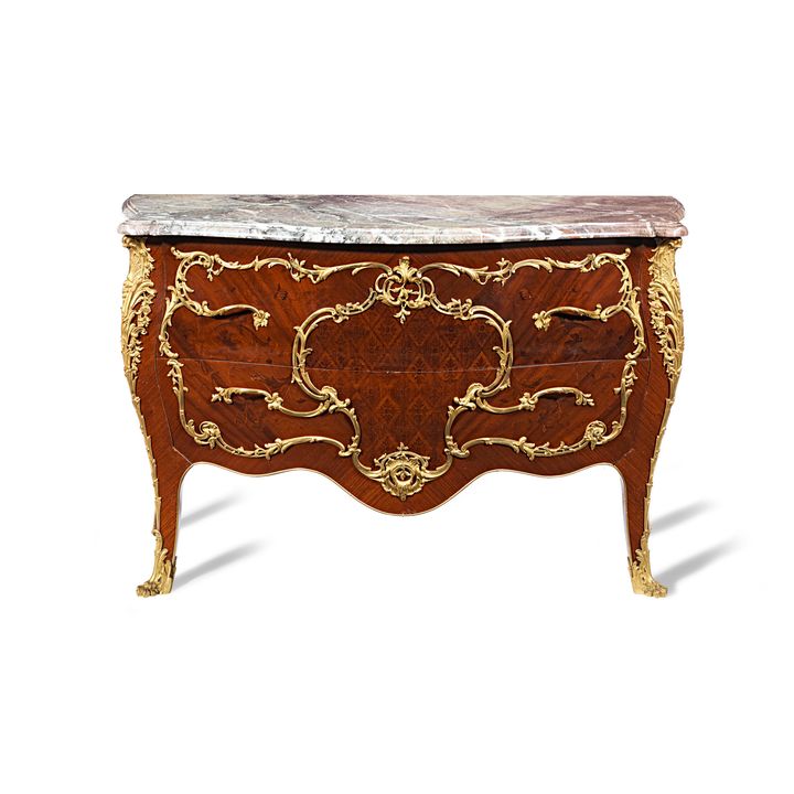 A late 19th century / early 20th century Louis XV style kingwood and marquetry commode retailed by M