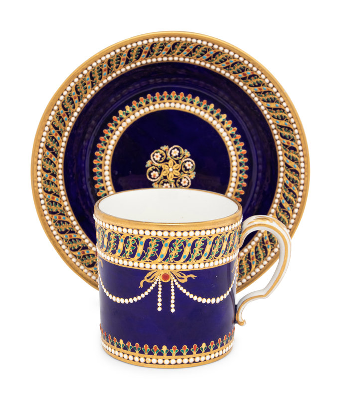 A Sèvres Partially Beau Bleu Jewelled Porcelain Coffee Can and Saucer (Gobelet 'Litron' et sa Soucoupe, 1ère Grandeur)