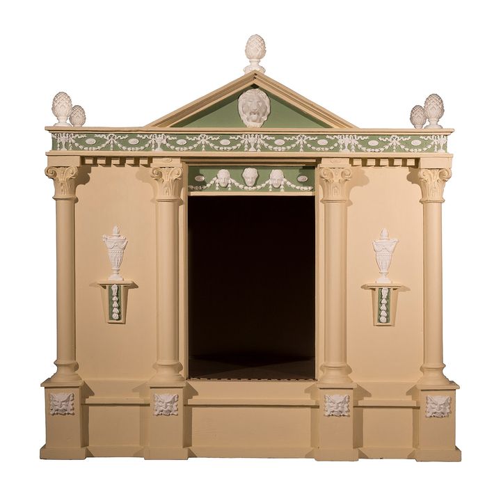 A neo-classical style cream, green and white painted dog kennel