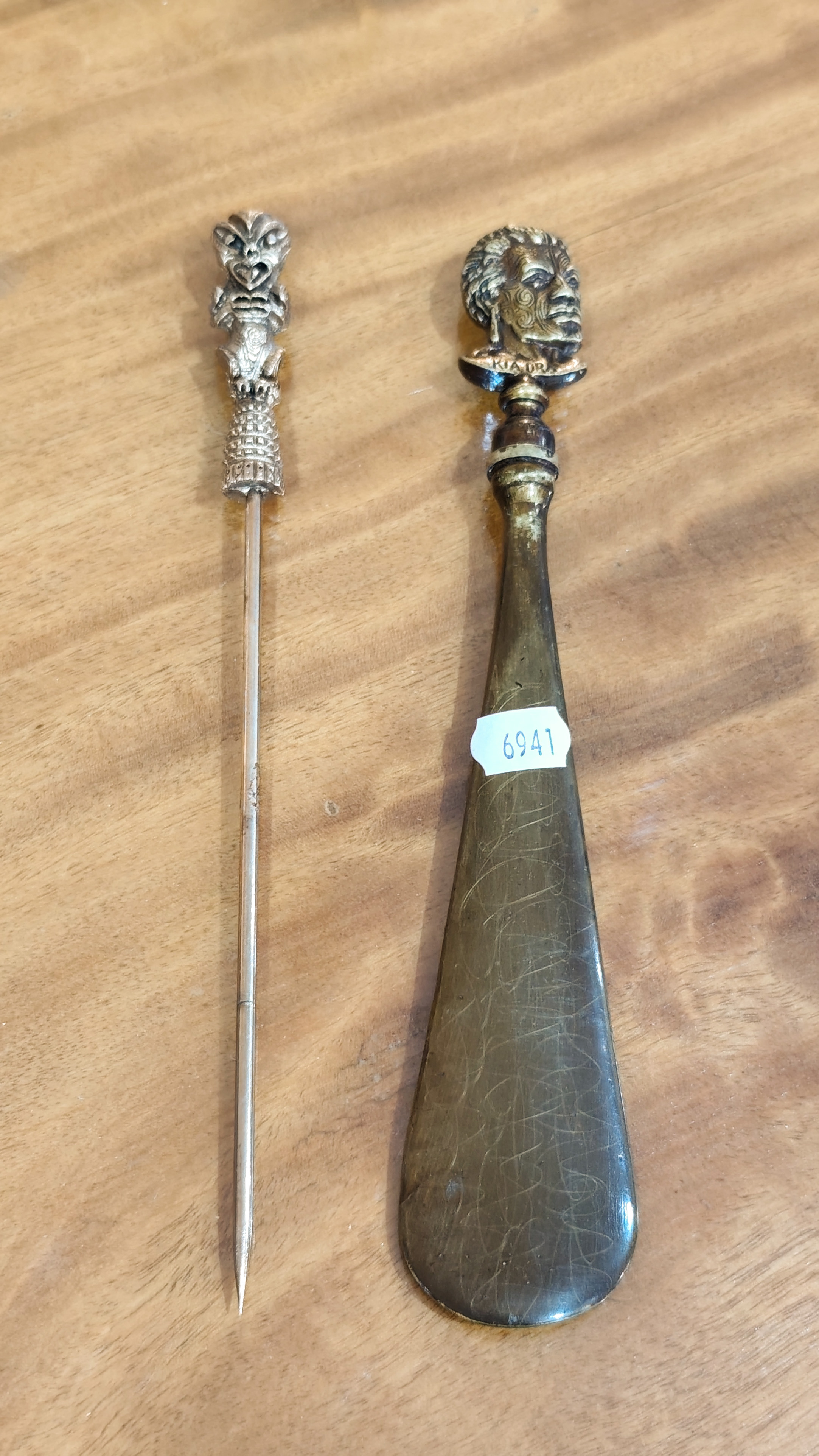 Maori Man Head Shoe Horn + Tiki Topped Hair Pin — NZ auction result